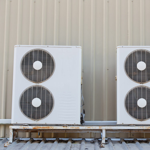 air conditioning units against a wall