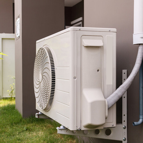 heat pump located on the side of a building