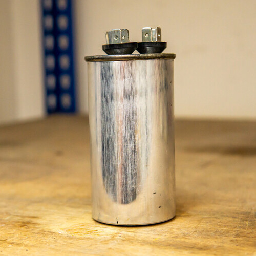 heater capacitor placed on a wooden table