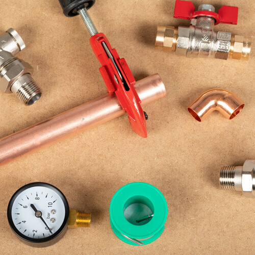 various heating system parts laid out on a table