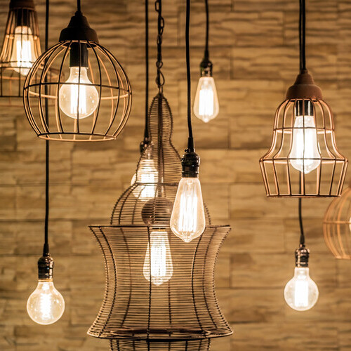 several lighting fixtures hanging from a ceiling